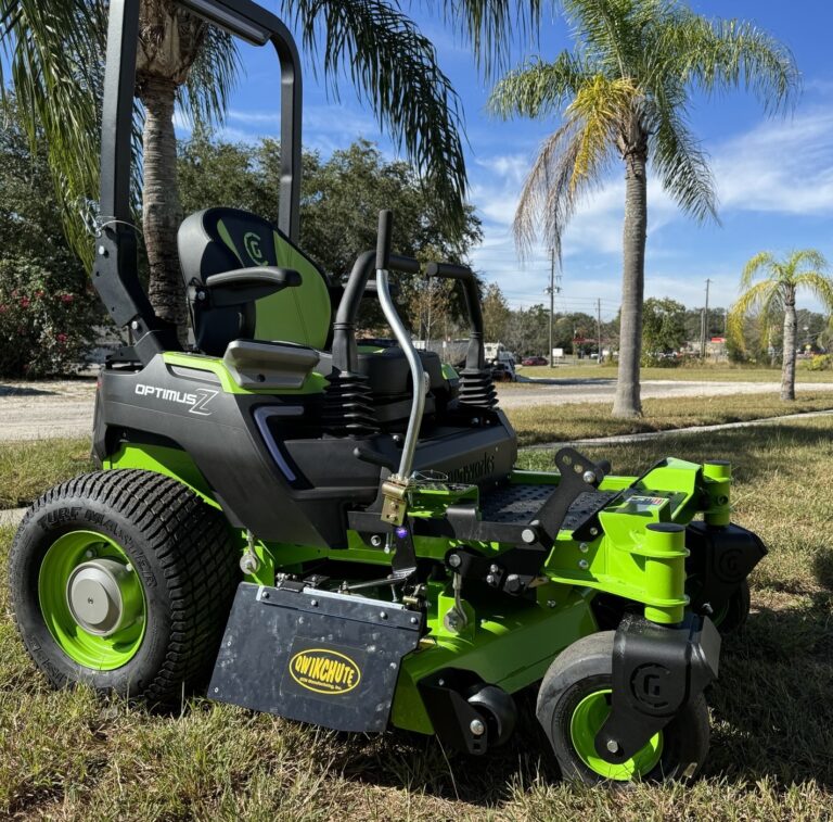 Qwikchute lawn mower chute blocker installed on a Greenworks Optimus Z with the door partially open
